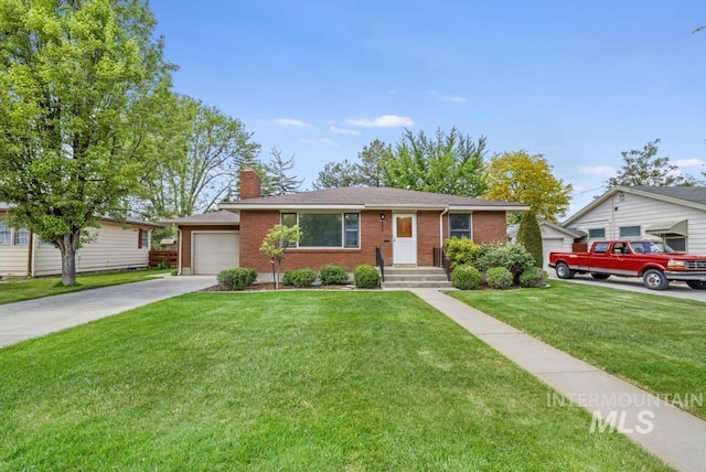 357 Pierce St, Twin Falls, ID 83301 - ranch-style house with brick siding, a chimney, driveway, and a front lawn
