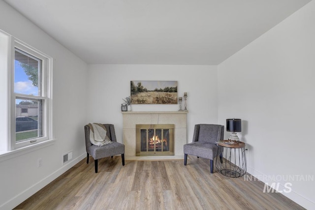 357 Pierce St, Twin Falls, ID 83301 - sitting room with wood finished floors, a tile fireplace, and baseboards