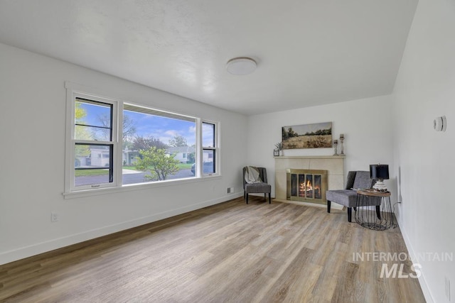357 Pierce St, Twin Falls, ID 83301 - living area featuring wood finished floors, a fireplace, and baseboards