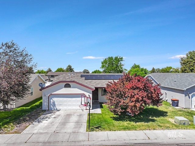 248 Sevensprings Ave, Twin Falls, ID 83301 - view of front of property with solar panels, a front lawn, driveway, and an attached garage