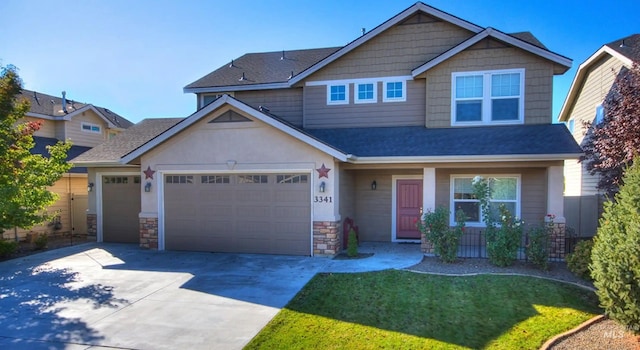 craftsman-style house featuring an attached garage, stone siding, a front lawn, and concrete driveway