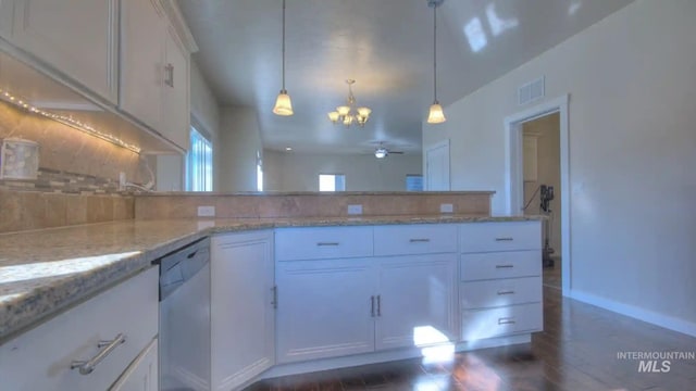 kitchen featuring light stone counters, backsplash, white cabinets, dishwasher, and a peninsula