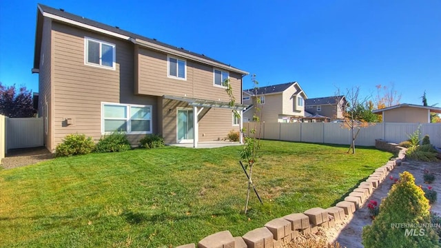 back of property featuring a patio area, a fenced backyard, a pergola, and a lawn