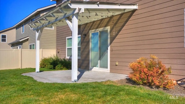 exterior space with a yard, a patio area, and fence