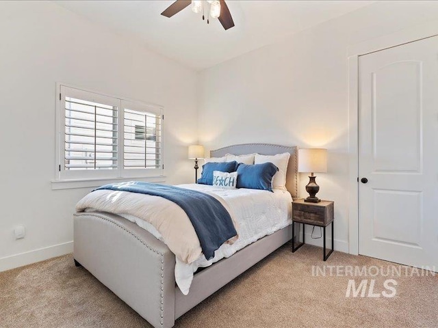 bedroom featuring baseboards, carpet, and a ceiling fan