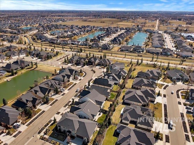 aerial view with a residential view and a water view