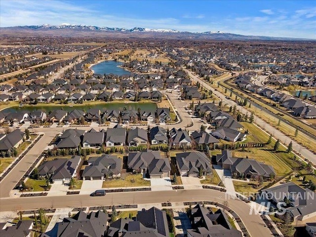 aerial view featuring a residential view and a water view