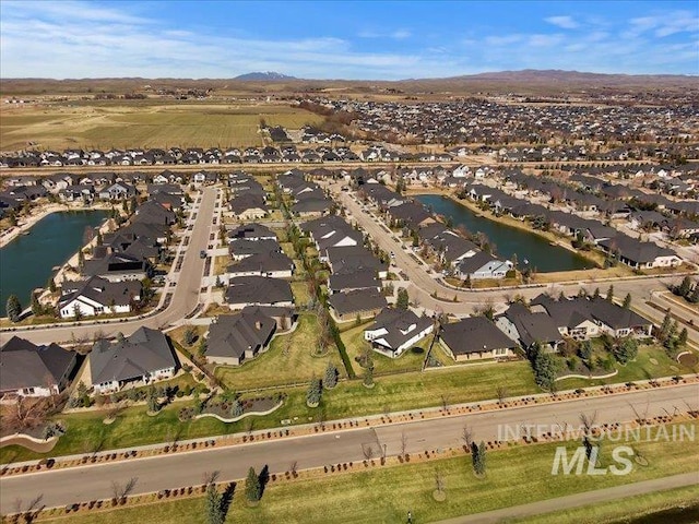 aerial view with a residential view and a water view