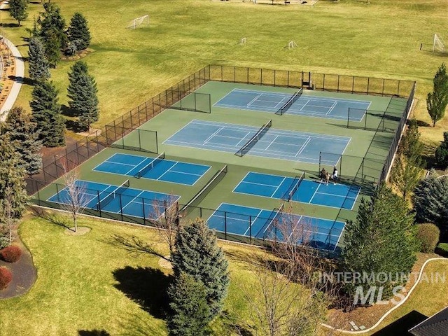 view of sport court with fence