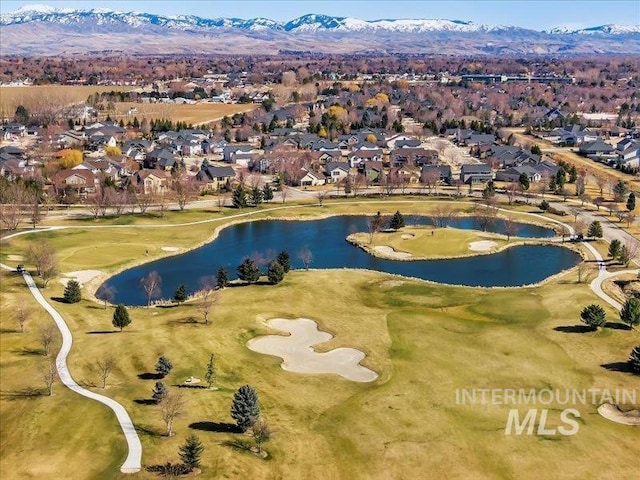 birds eye view of property featuring a residential view and a water and mountain view