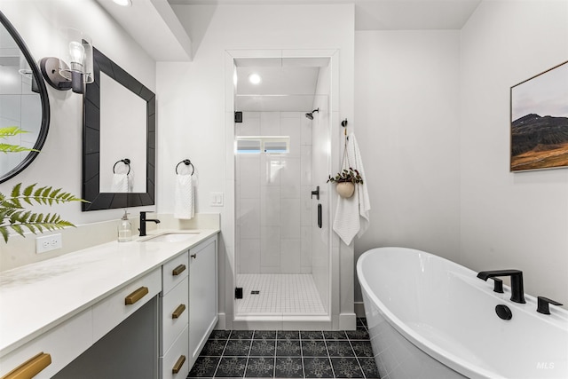full bathroom with vanity, tile patterned flooring, recessed lighting, a freestanding bath, and a stall shower