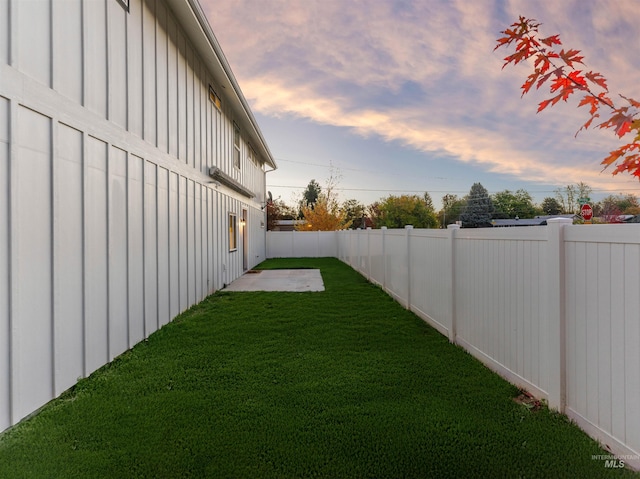 view of yard with a fenced backyard and a patio area