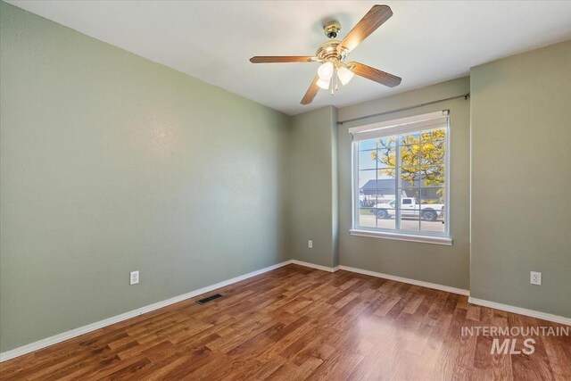 1600 Peregrine, Mountain Home, ID 83647 - unfurnished room featuring wood finished floors, a ceiling fan, and baseboards