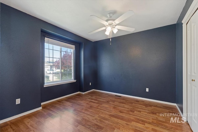 1600 Peregrine, Mountain Home, ID 83647 - unfurnished room featuring wood finished floors, a ceiling fan, and baseboards