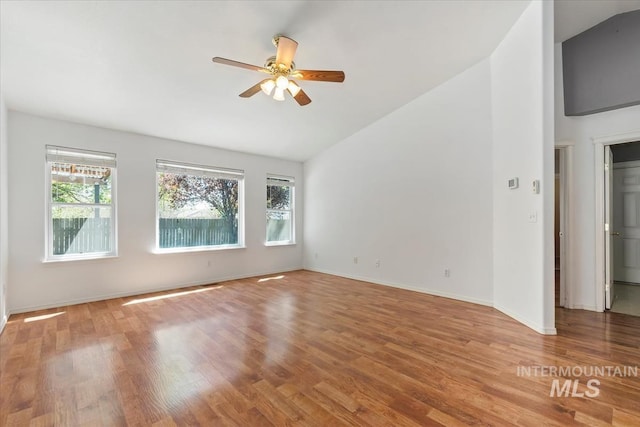 1600 Peregrine, Mountain Home, ID 83647 - spare room with vaulted ceiling, healthy amount of natural light, ceiling fan, wood finished floors, and baseboards