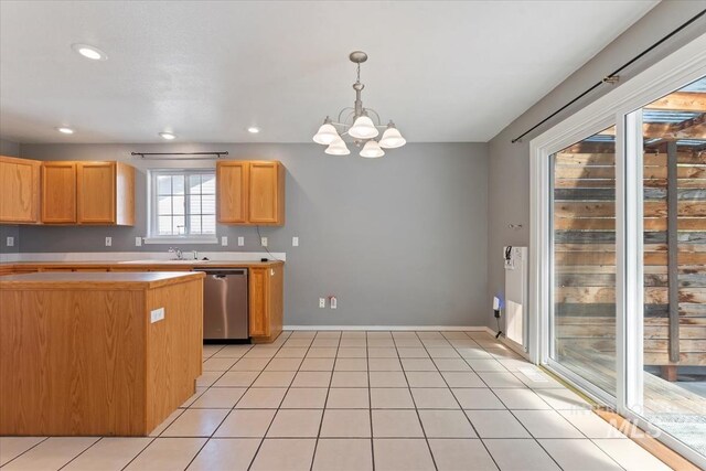1600 Peregrine, Mountain Home, ID 83647 - kitchen featuring stainless steel dishwasher, light countertops, a chandelier, baseboards, and pendant lighting