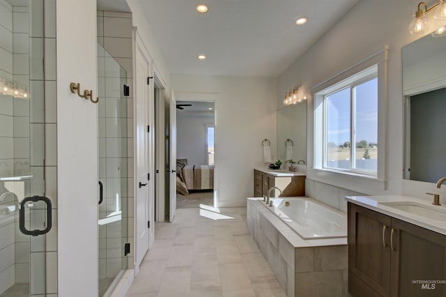 bathroom with independent shower and bath and vanity