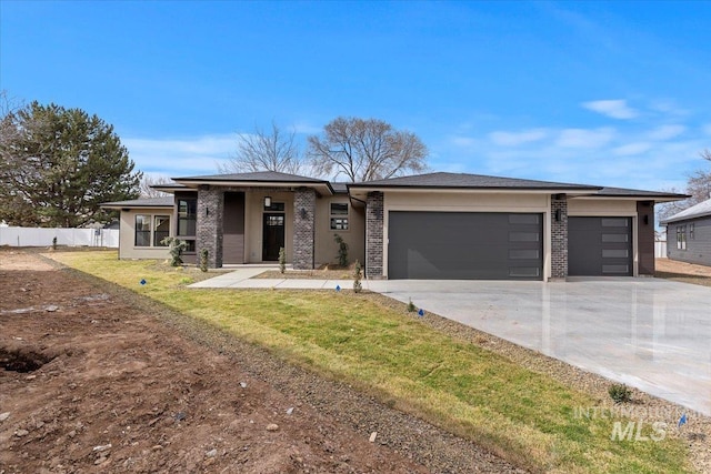 view of front facade featuring brick siding, driveway, an attached garage, and fence