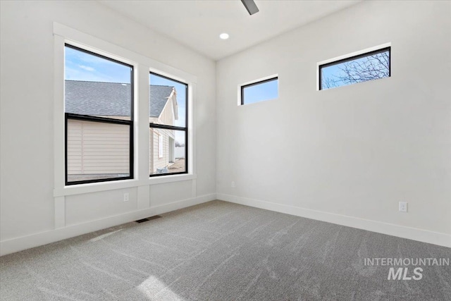 unfurnished room featuring recessed lighting, carpet, visible vents, and baseboards