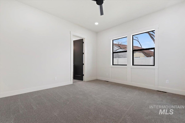 carpeted empty room featuring a ceiling fan, recessed lighting, visible vents, and baseboards