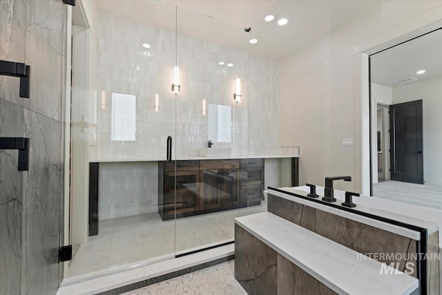 full bath featuring a stall shower, visible vents, and recessed lighting