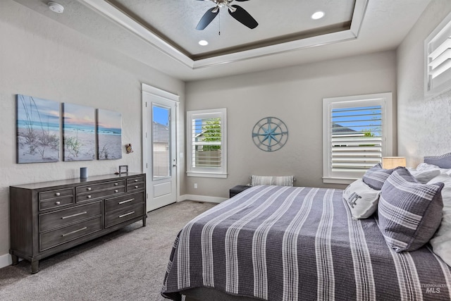 18279 N Tulip Ave, Nampa, ID 83687 - bedroom with ceiling fan, light colored carpet, a raised ceiling, baseboards, and access to outside