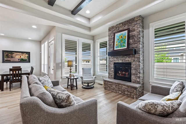 18279 N Tulip Ave, Nampa, ID 83687 - living room with recessed lighting, a stone fireplace, a wealth of natural light, and light wood-style floors