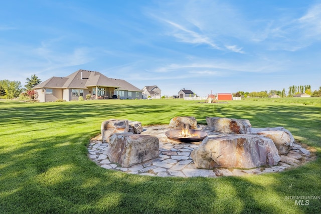 2466 Brooks Dr, Fruitland, ID 83619 - view of green lawn featuring an outdoor fire pit