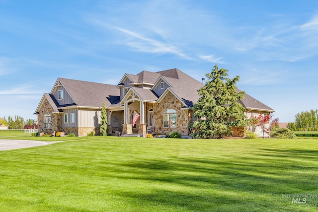 2466 Brooks Dr, Fruitland, ID 83619 - craftsman inspired home with stone siding, board and batten siding, a front lawn, and roof with shingles
