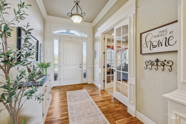 2466 Brooks Dr, Fruitland, ID 83619 - entryway with ornamental molding, light wood finished floors, and french doors