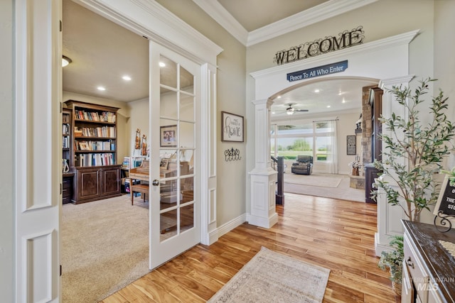 2466 Brooks Dr, Fruitland, ID 83619 - entryway featuring decorative columns, crown molding, light wood-style floors, a ceiling fan, and recessed lighting