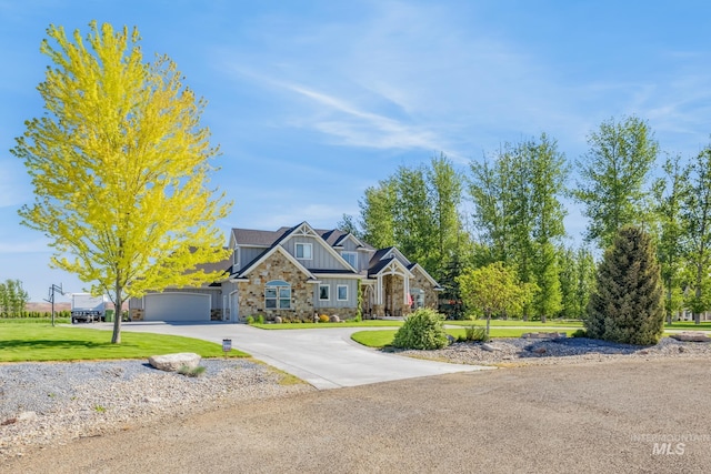 2466 Brooks Dr, Fruitland, ID 83619 - craftsman inspired home featuring board and batten siding, stone siding, a front yard, curved driveway, and a garage
