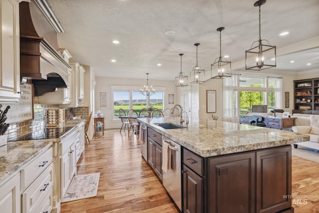 2466 Brooks Dr, Fruitland, ID 83619 - kitchen with a sink, dishwasher, healthy amount of natural light, open floor plan, and recessed lighting