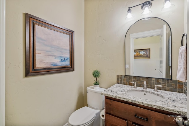 2466 Brooks Dr, Fruitland, ID 83619 - half bath with toilet, tasteful backsplash, and vanity