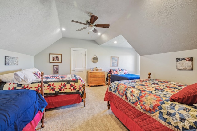 2466 Brooks Dr, Fruitland, ID 83619 - carpeted bedroom featuring vaulted ceiling, a textured ceiling, a ceiling fan, and recessed lighting