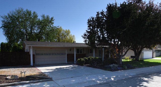 8395 W Golse Dr, Boise, ID 83704 - single story home with concrete driveway, an attached garage, and fence