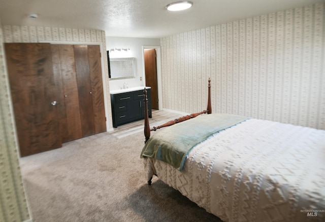 8395 W Golse Dr, Boise, ID 83704 - bedroom featuring light carpet, wallpapered walls, and a sink