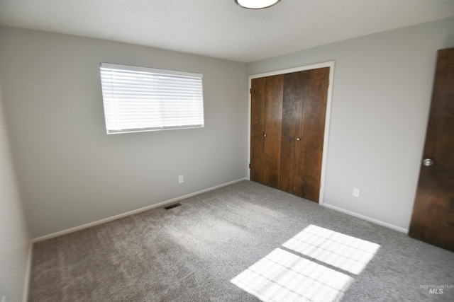 8395 W Golse Dr, Boise, ID 83704 - unfurnished bedroom with carpet floors, a closet, baseboards, and visible vents