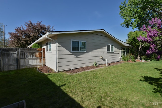 8395 W Golse Dr, Boise, ID 83704 - view of property exterior featuring a lawn and fence