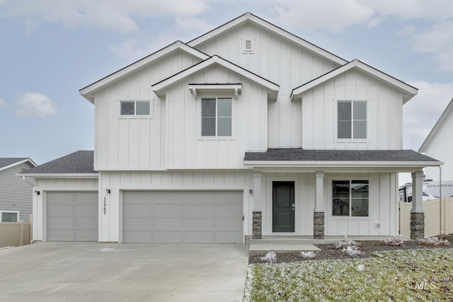 modern inspired farmhouse with roof with shingles and board and batten siding