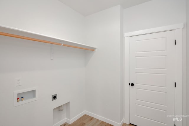 laundry room with washer hookup, electric dryer hookup, and light hardwood / wood-style floors