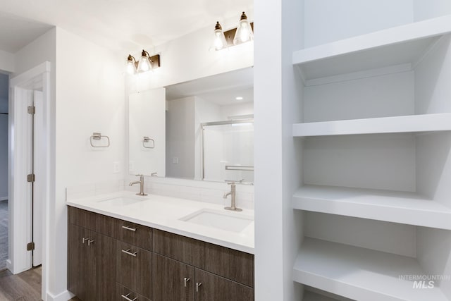 bathroom featuring double vanity and a sink