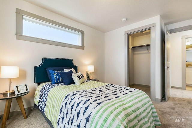 6303 W Stavros Dr, Meridian, ID 83646 - carpeted bedroom with baseboards, a closet, and a walk in closet
