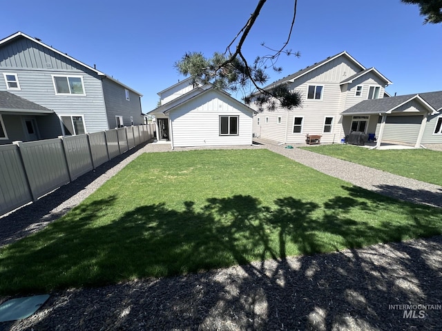 6303 W Stavros Dr, Meridian, ID 83646 - rear view of house featuring board and batten siding