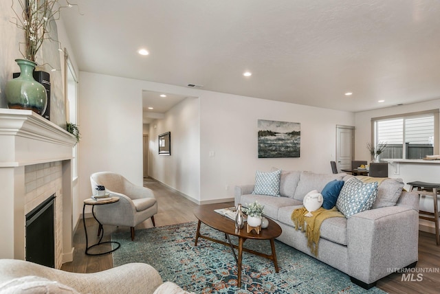 6303 W Stavros Dr, Meridian, ID 83646 - living area featuring wood finished floors, recessed lighting, a fireplace, and baseboards