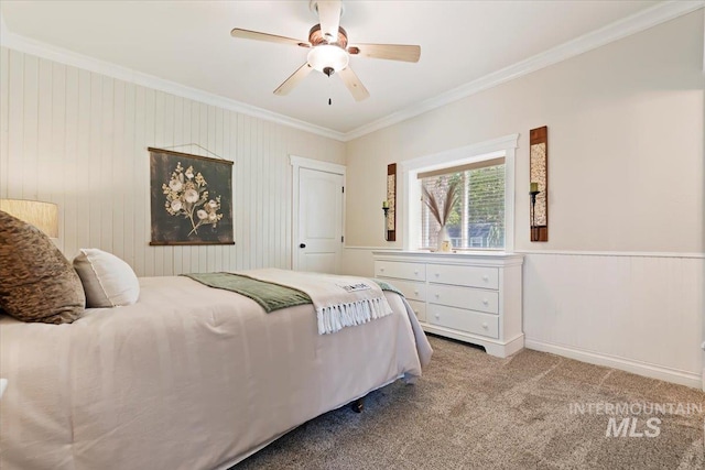 carpeted bedroom with crown molding and ceiling fan