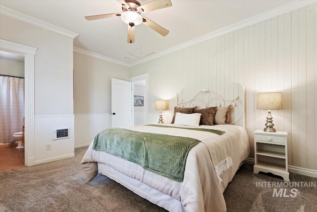 bedroom featuring ornamental molding, carpet, a ceiling fan, and ensuite bath