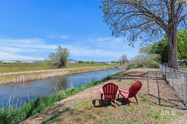 water view featuring fence