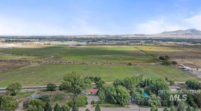 aerial view with a mountain view and a rural view