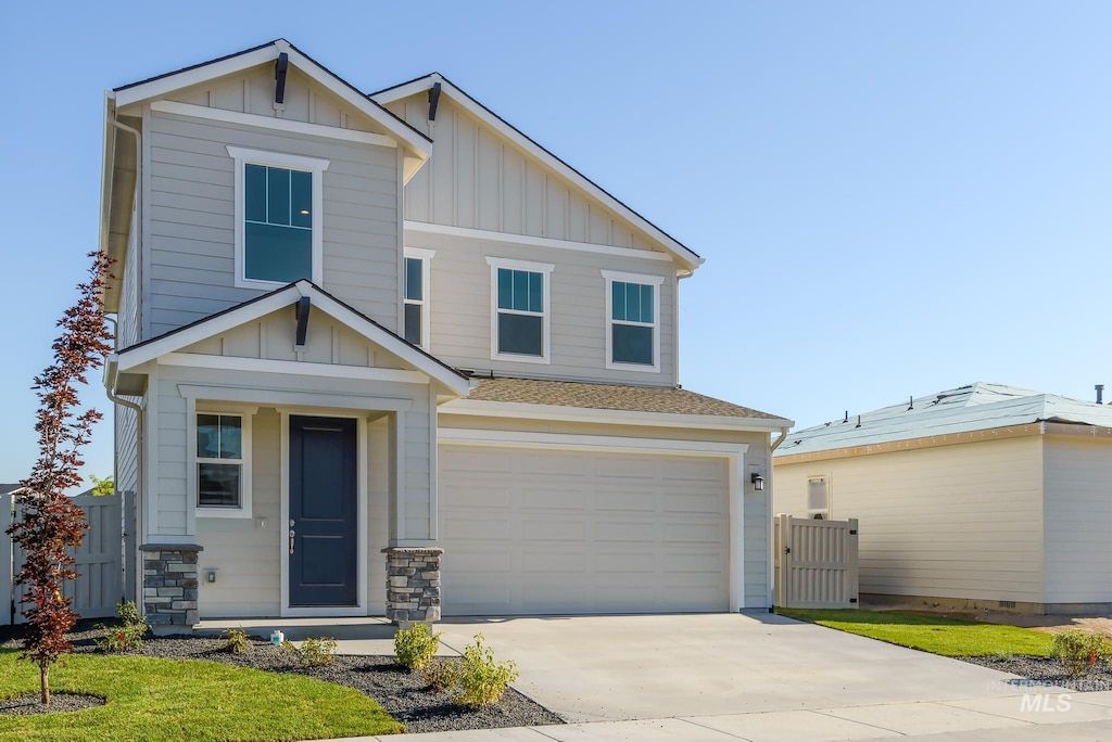 craftsman-style home with a garage and a front yard